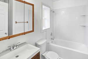 Full bathroom featuring vanity and bathing tub / shower combination