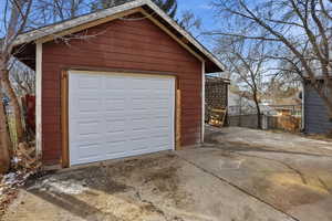 Detached garage with concrete driveway