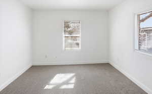 Unfurnished room with light colored carpet