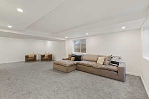 Living room featuring carpet and recessed lighting