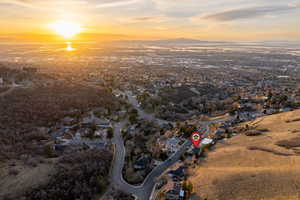 Aerial perspective of suburban area with a mountain backdrop