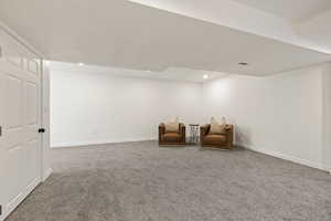 Living area featuring carpet flooring and recessed lighting