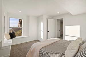 Carpeted bedroom featuring baseboards and recessed lighting