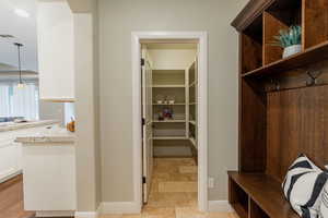 Mudroom featuring baseboards and recessed lighting