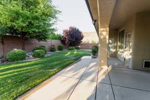 Fenced backyard with a patio