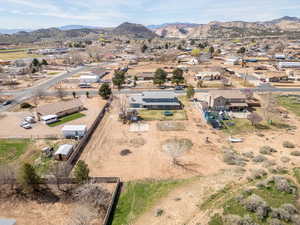 Aerial perspective of suburban area with a mountainous background