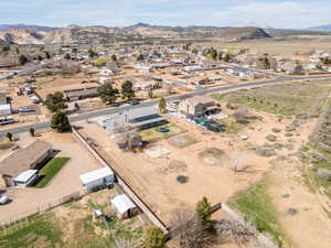 Aerial perspective of suburban area featuring a mountain backdrop