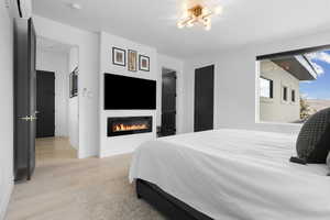 Primary Bedroom with Ensuite Bath, electric fireplace and two Walk-in Closets