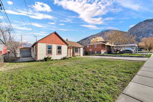 View of front of house featuring a mountain view and side gate
