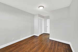 Bedroom with closet and hardwood floors