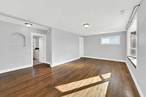 Front living room with hardwood floors and bay window. Lots of natural light