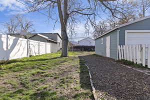 View of backyard with detached garage