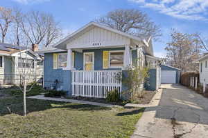 Bungalow-style house with a porch and garage.