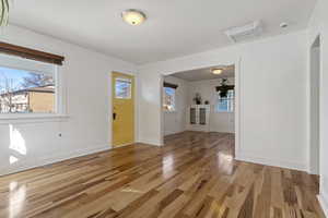 Foyer featuring light wood-style floors and cooling unit