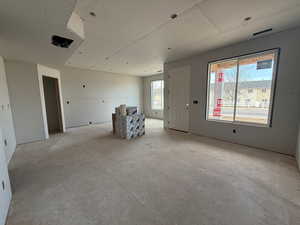 Unfurnished room with concrete floors