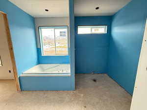 Full bathroom featuring a bath