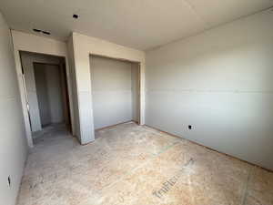 Unfurnished bedroom with a closet