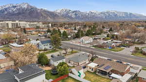 Aerial perspective of suburban area with a mountainous background