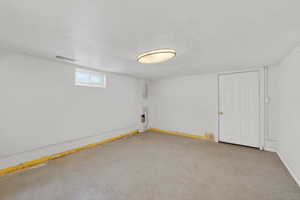 Below grade area featuring baseboards