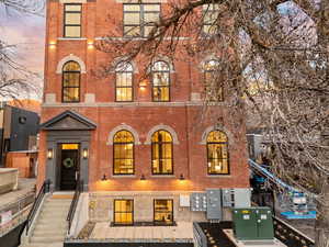 Italianate home featuring brick siding