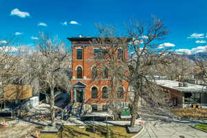 Italianate-style house featuring brick siding