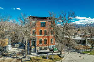 View of front of house featuring brick siding and a mountain view