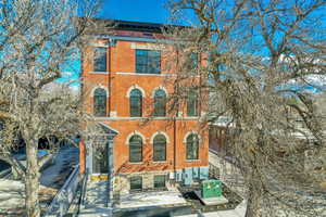 Italianate house featuring brick siding