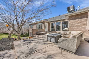 View of patio / terrace with an outdoor living space with a fire pit