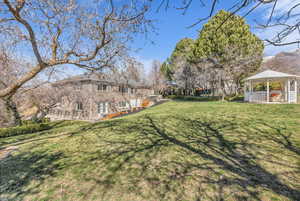 View of green lawn with a gazebo