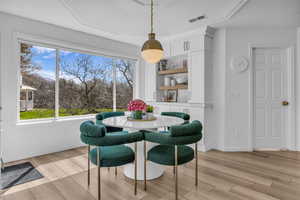 Dining area with light wood finished floors