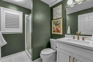 Bathroom with a shower stall, vanity, and a textured ceiling