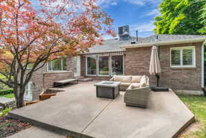 Expansive concrete patio offering a dedicated outdoor living area