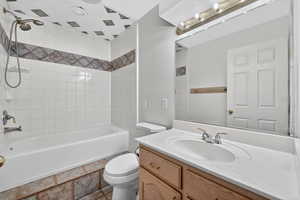 Bathroom featuring vanity and shower / bath combination