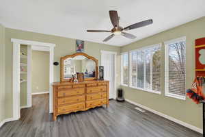 Bedroom featuring ceiling fan and wood finished floors