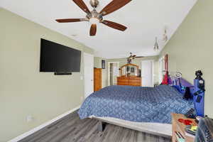Bedroom with ceiling fan and wood finished floors