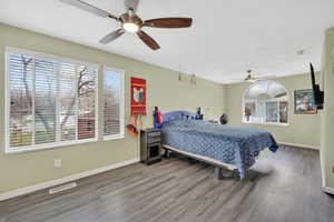 Bedroom featuring a ceiling fan and wood finished floors