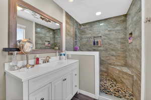 Bathroom featuring vanity and walk in shower