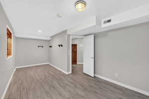 Below grade area with wood finish floors and baseboards