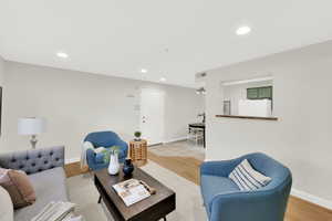 Living room featuring recessed lighting and light wood-style floors