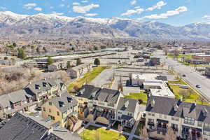 Aerial perspective of suburban area with a mountainous background