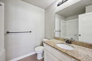 Primary Bathroom featuring vanity and a textured ceiling