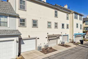 Exterior space featuring stucco siding, driveway, and an attached garage 2 tandem