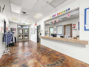 Reception featuring a paneled ceiling