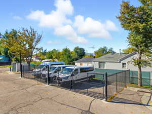 View of parking with a gate