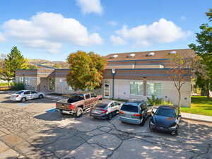 View of front of house featuring uncovered parking and a mountain view