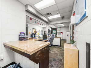 Miscellaneous room with a paneled ceiling