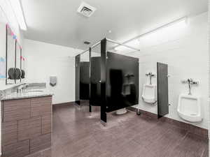 Bathroom with tile walls and concrete block wall