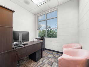 Office space with a paneled ceiling