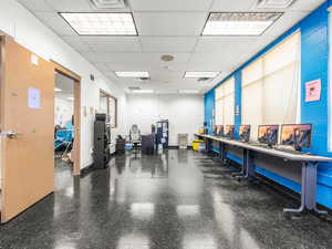 Miscellaneous room with a paneled ceiling