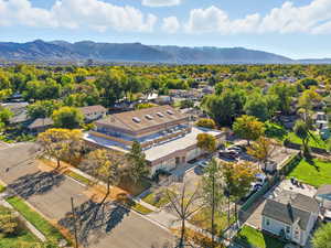 Aerial perspective of suburban area featuring a mountain backdrop